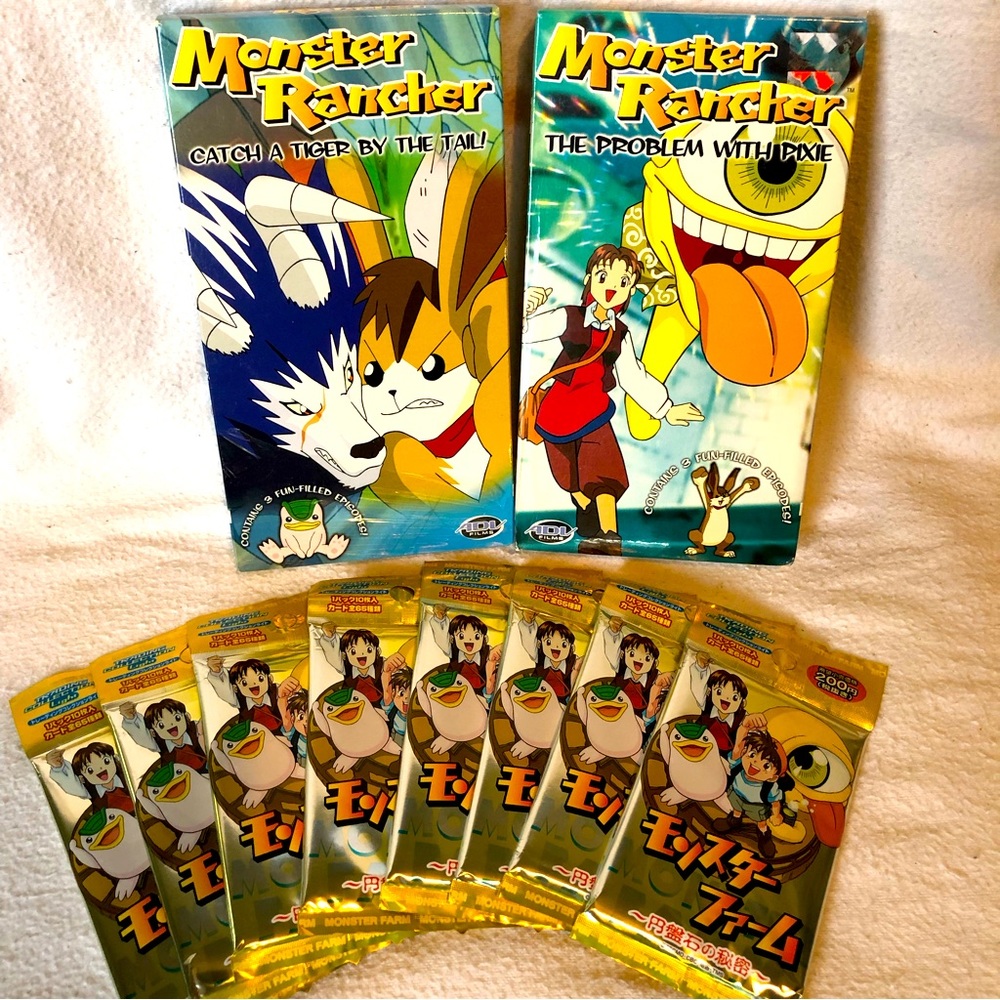 Monster Rancher VHS tapes (2) and 8 Monster Farm sealed booster packs